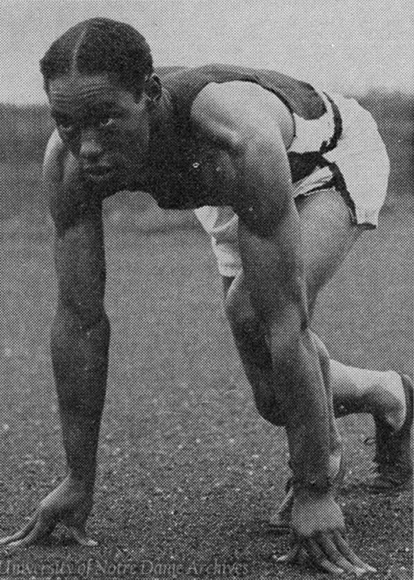 Frazier Thompson in a running race starting stance. Photo from University of Notre Dame archives